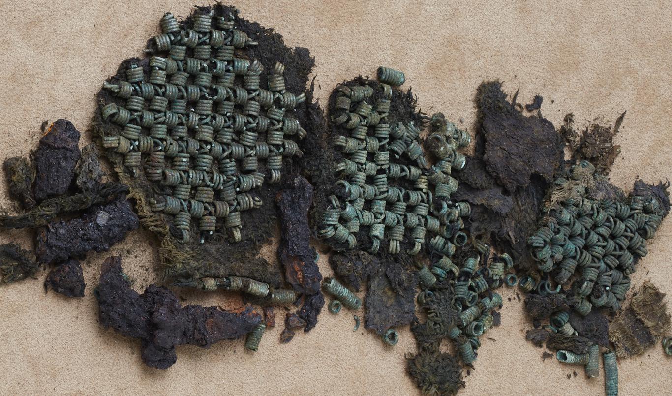 Square decorations made of copper-alloy coils from the Eura woman's apron. 